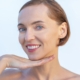 Woman smiling after professional teeth whitening treatment