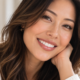 Woman smiling for an article comparing composite bonding and porcelain veneers
